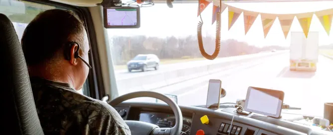 18-wheeler truck on the road with a phone symbol to represent distracted driving as a leading cause of crashes