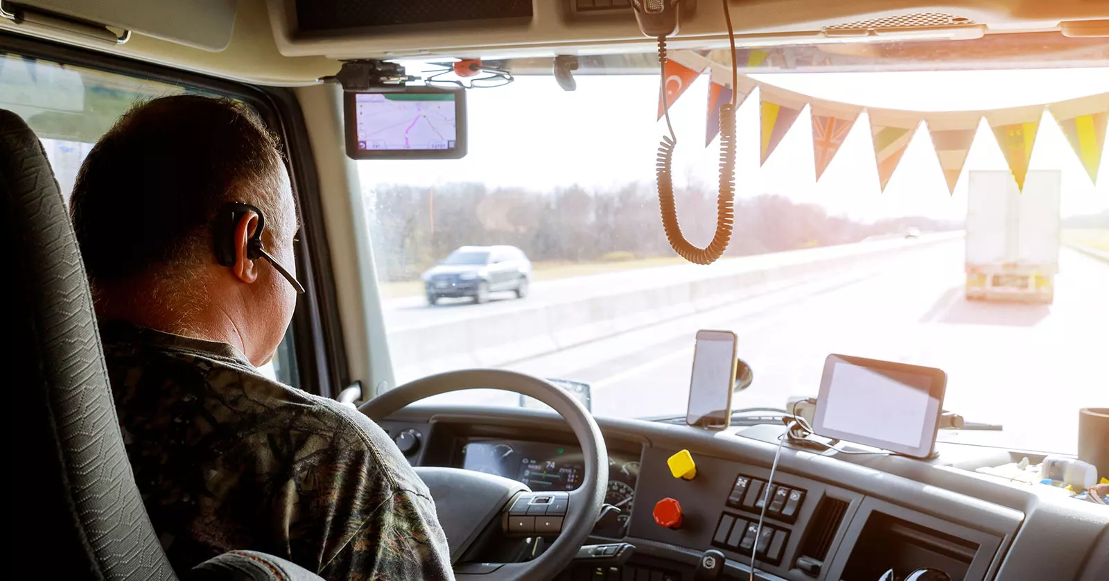 18-wheeler truck on the road with a phone symbol to represent distracted driving as a leading cause of crashes