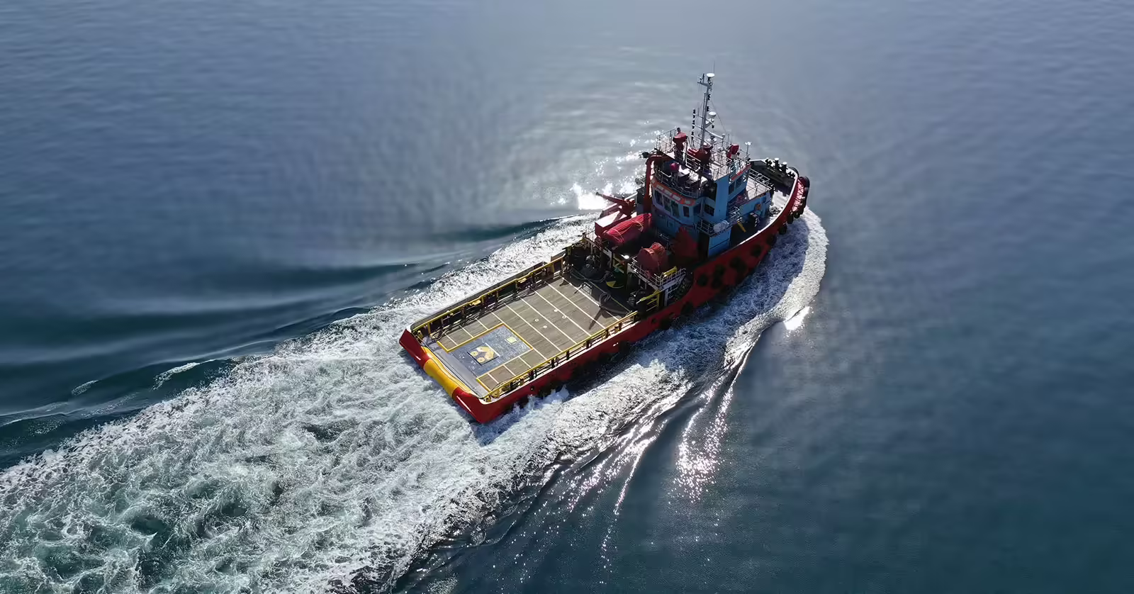 Jones Act Vessel A tugboat sailing in the ocean.