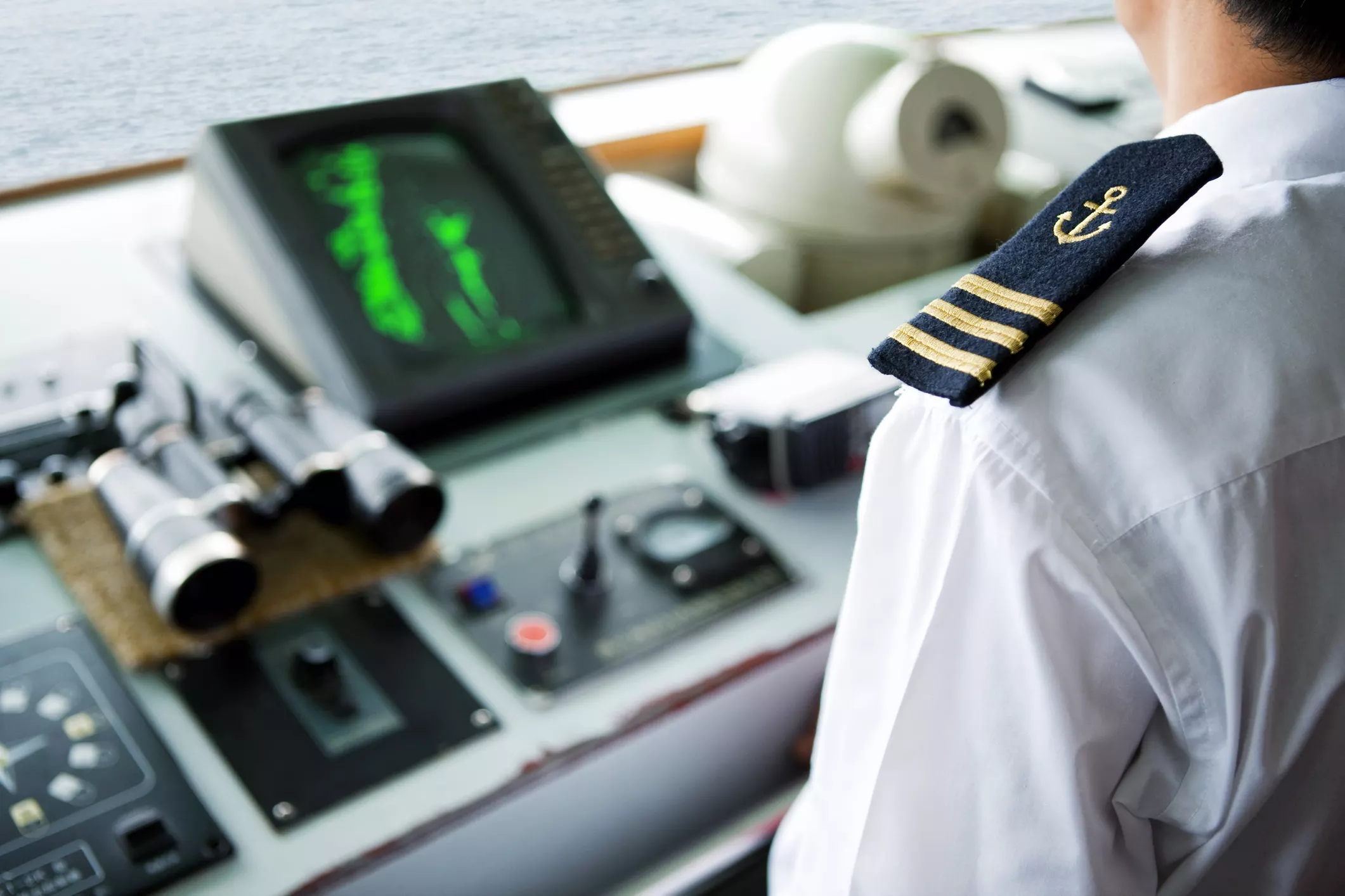 Hiring maritime injury lawyers for maritime accidents- Ship officer in the Bridge performing watch duties.