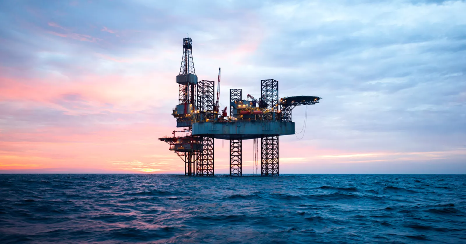 Offshore drilling for oil concept - Jack up rig in the middle of the sea.