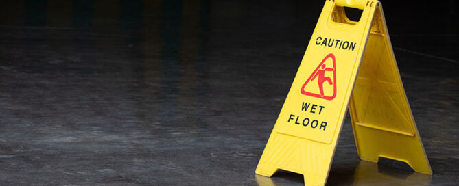 Wet floor sign on oily floor