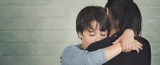 Son of a widow consoling a client during a wrongful death lawsuit discussion