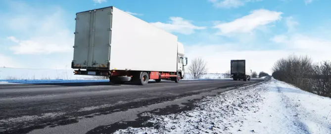 18-wheelers on the road during winter