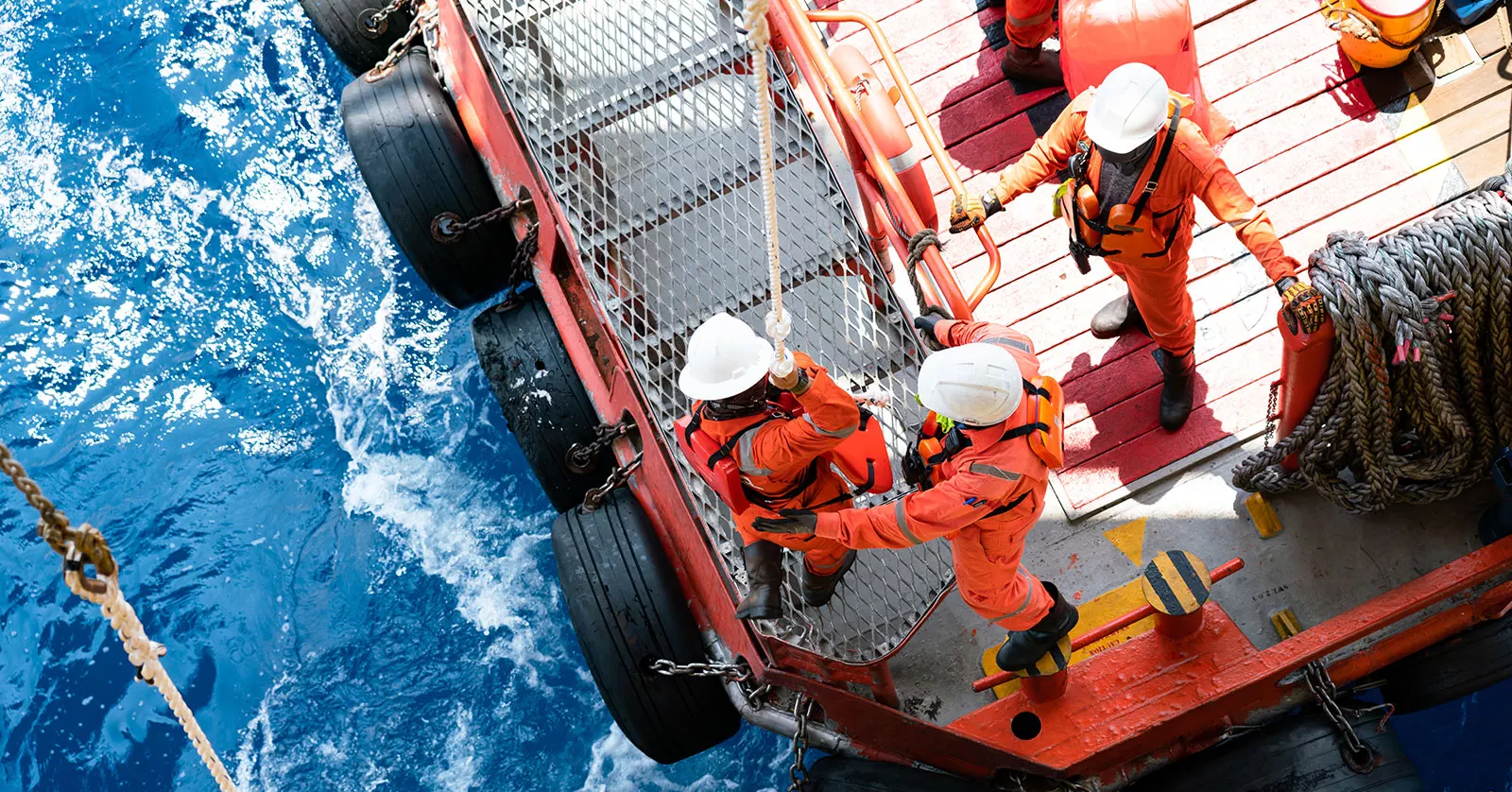 Seamen working at sea