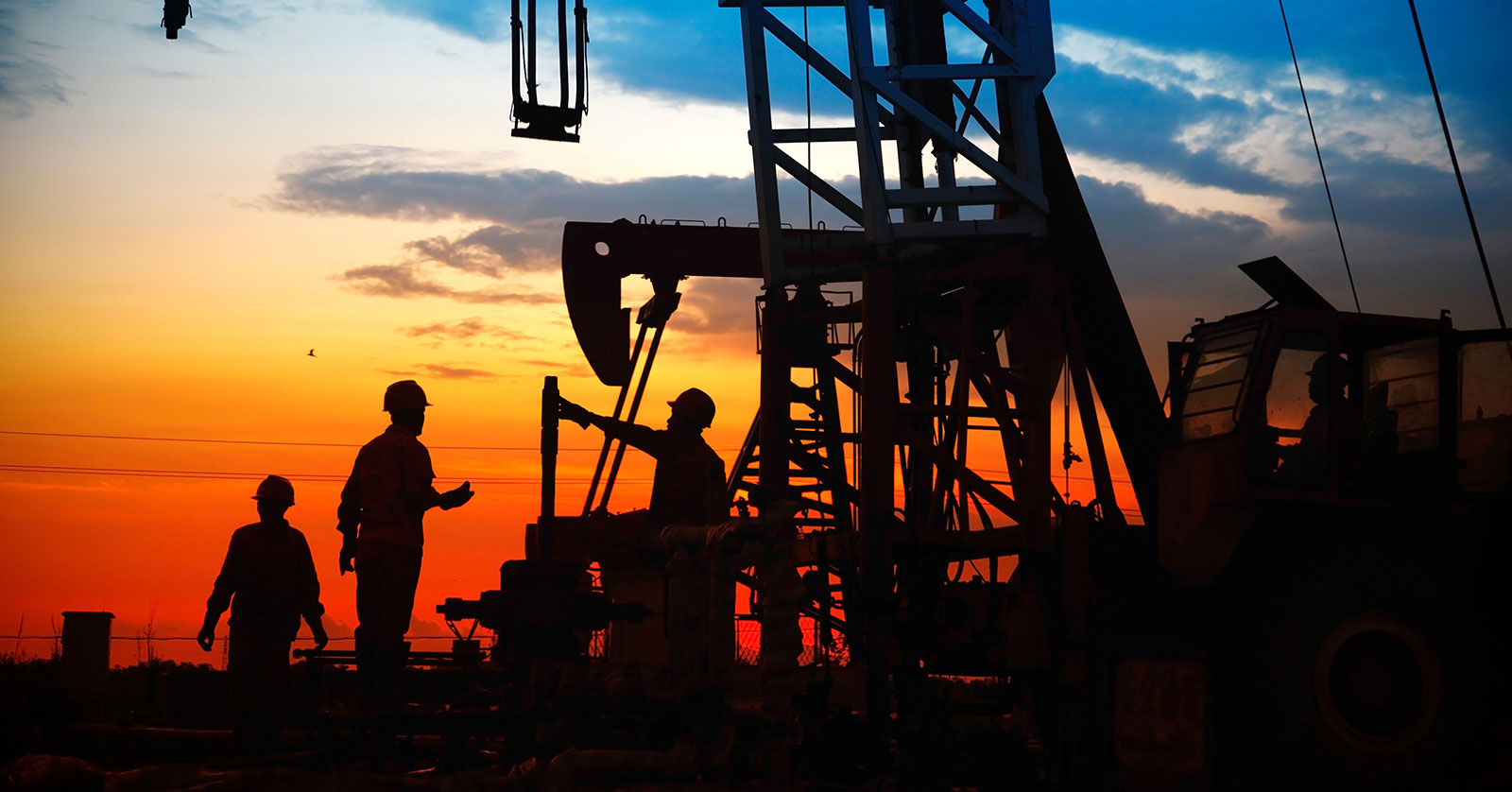 oilfield workers discussing in the oil field